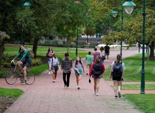 Students walk outside on campus